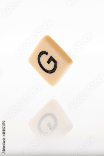 Alphabet G word block with white background.