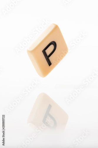 Alphabet P word block with white background.