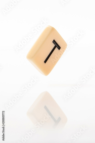 Alphabet T word block with white background.