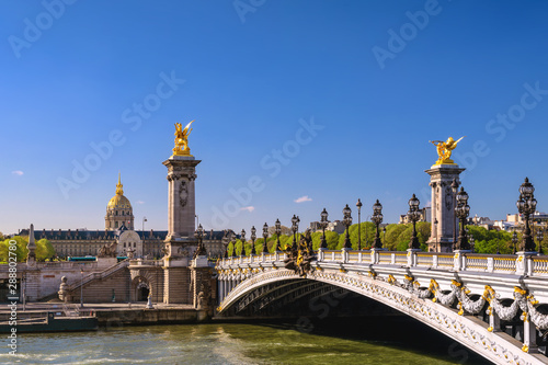 Paris France city skyline at Seine River with Pont Alexandre III bridge