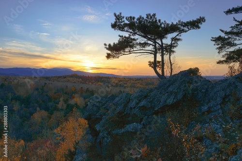 Autumn sunset in the mountains. Mountain ridge Khekhtsir. Bolshekhekhtsirsky Nature Reserve. Khabarovsk region, far East, Russia. 
