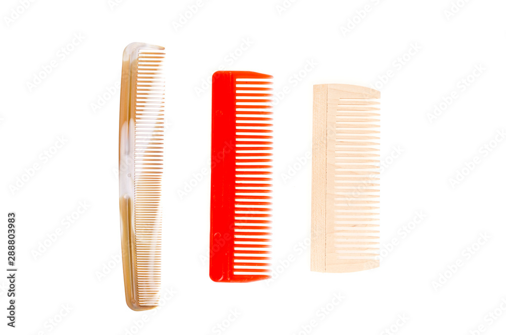 Three colored hair combs. Studio Photo