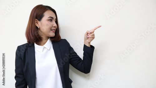 business woman pointing up over white background