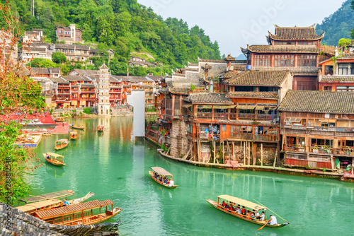Fabulous view of wooden tourist boats on the Tuojiang River photo