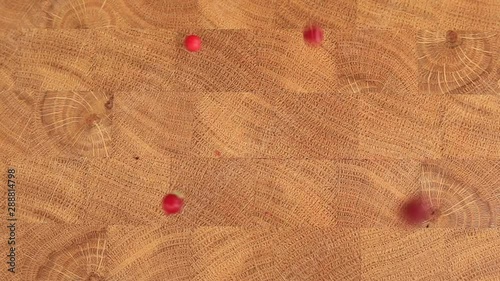 Autumn background with red berries and grass. Berries in a basket