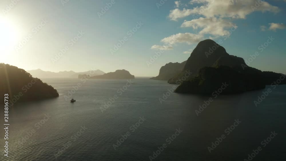aerial view tropical bay in El Nido at sunset. Seascape with mountains and rocky islands in the morning time. Sunset sky and mountains rocks of bay. Dreamy sunset among the rocks. aerial view tropical bay in El Nido at sunset. Seascape with mountains and rocky islands in the morning time. Sunset sky and mountains rocks of bay. Dreamy sunset among the rocks.