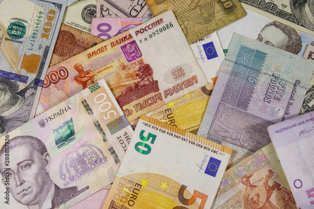 Obraz premium Multicurrency background of euros US dollars, Russian rubles, Egyptian pounds and Ukrainian hryvnias