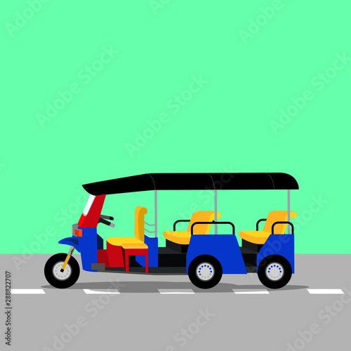 Three-wheeled tuk-tuk taxi on he road. 