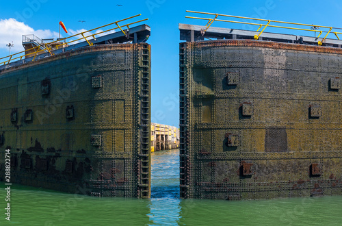 The Panama Canal gate locks of Miraflores opening on a lovely summer day near Panama City. photo