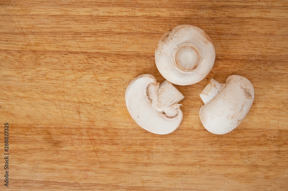 fresh mushrooms on a wooden board fresh mushrooms on a wooden board