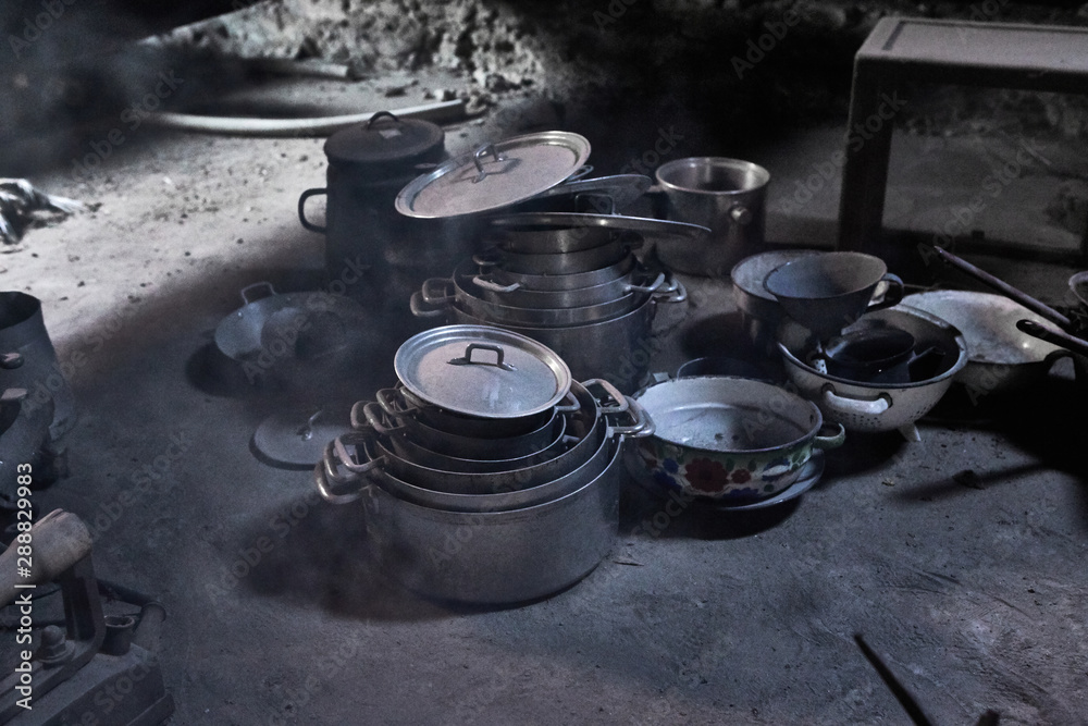 Group of old metalic pots in dirty rustic interior. Group of old metalic pots in dirty rustic interior.