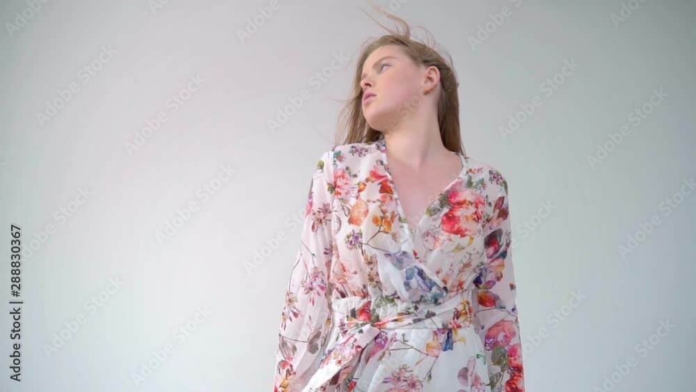 Fashion model with red hair in a flying dress Fashion model with red hair in a flying dress