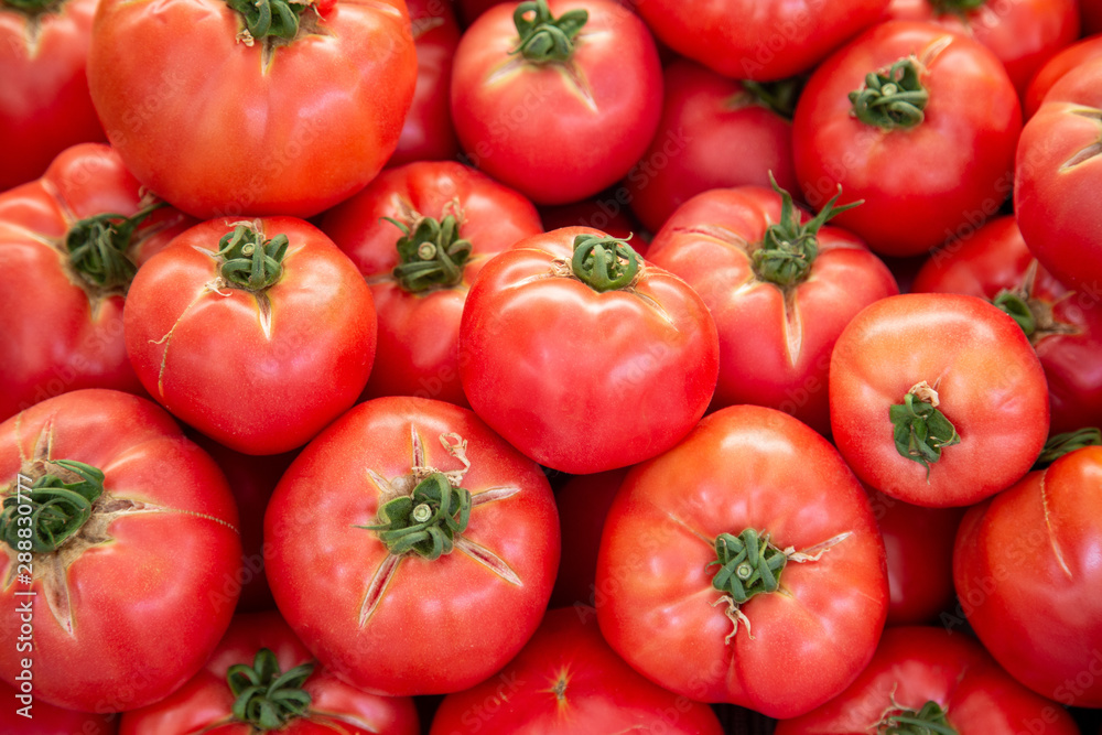 Organic tomatoes at the fam maket. Background with copy space. Organic tomatoes at the fam maket. Background with copy space.