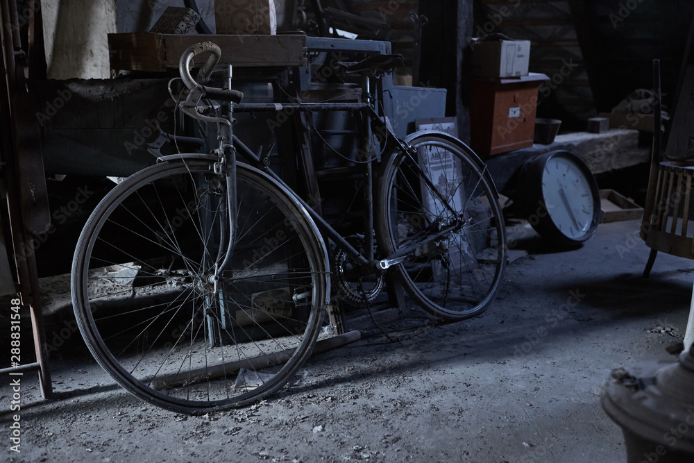 A vintage bicycle inside an old dirty cellar