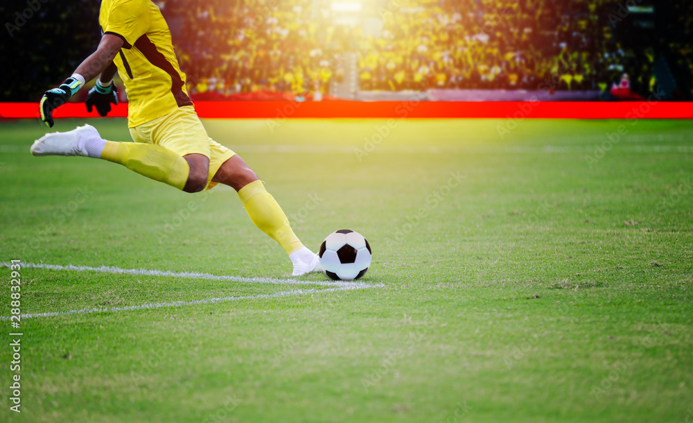 soccer or football player standing with ball on the field for Kick the soccer ball at football stadium soccer or football player standing with ball on the field for Kick the soccer ball at football stadium