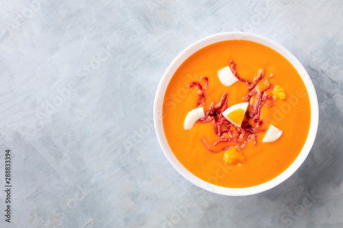 Salmorejo, Spanish cold tomato soup, shot from the top with a place for text photo