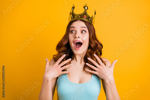 Photo of foxy lady nominated as college celebrity wear big golden headwear and tank-top isolated yellow background