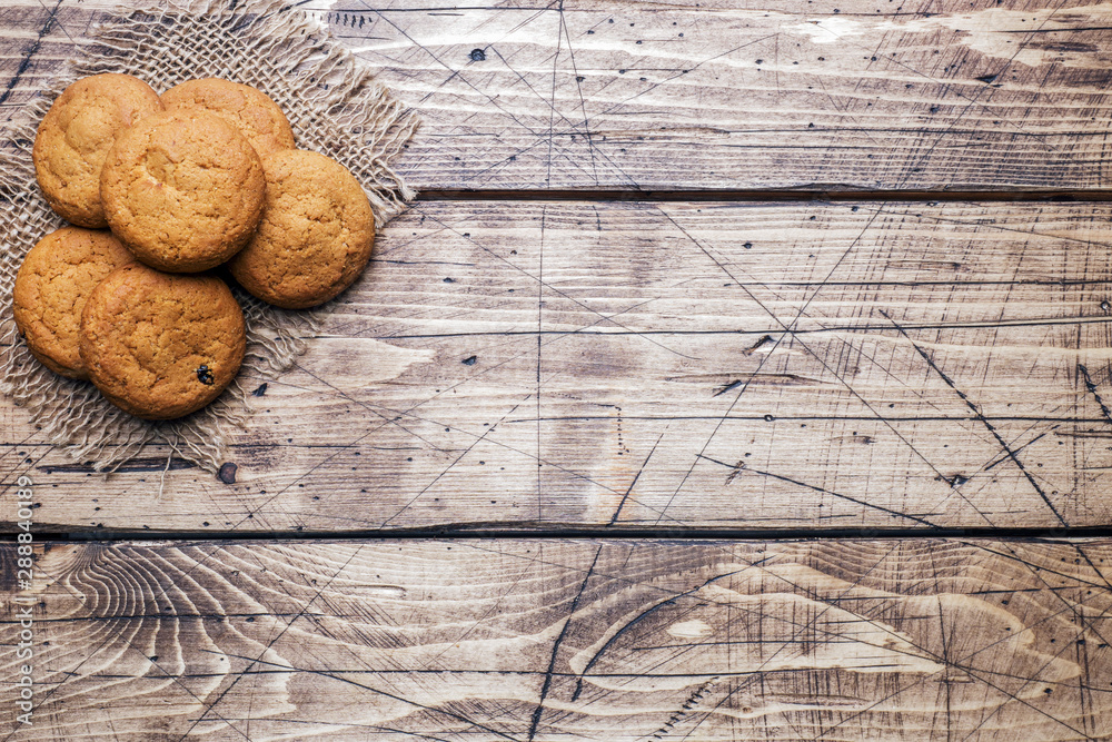 Natural oatmeal cookies on wooden background. Rustic style. Copy space Natural oatmeal cookies on wooden background. Rustic style. Copy space