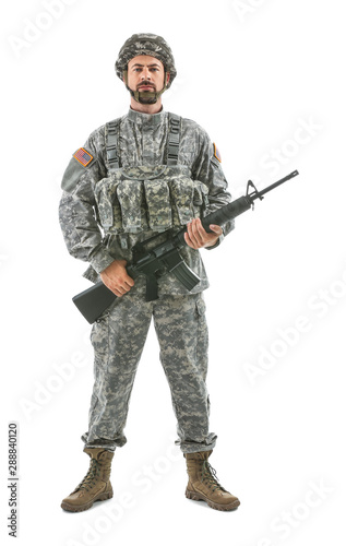 Soldier with assault rifle on white background