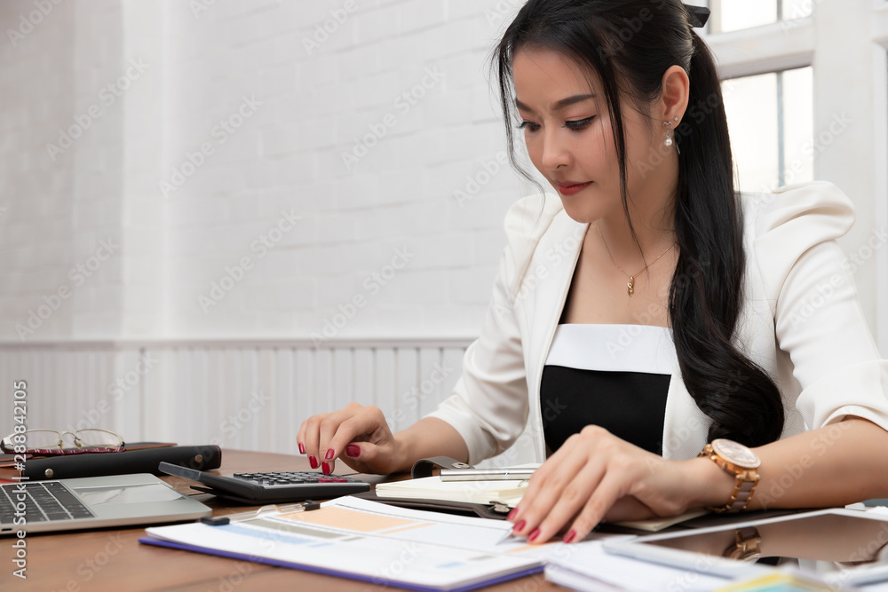 Business and finance concept of office working, Businesswoman discussing sale analysis Chart Business and finance concept of office working, Businesswoman discussing sale analysis Chart