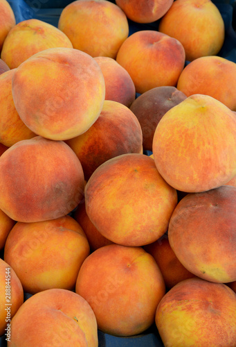 organic and fresh peaches at the market