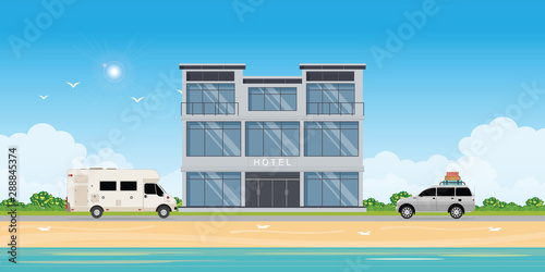 Hotel building near sea or seafront resort view on beach.
