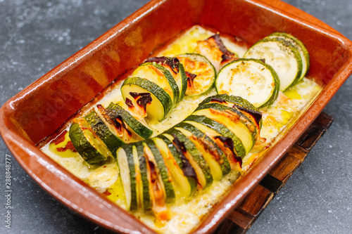 Baked Stuffed zucchini with cheese and turkey ham.