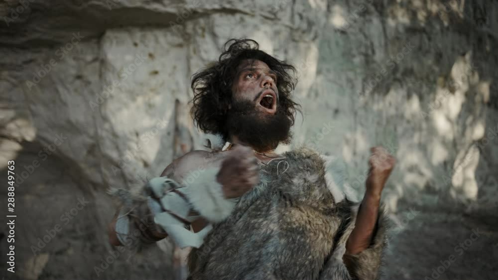 Portrait of Primeval Caveman Wearing Animal Skin Does Threatening Chest ...