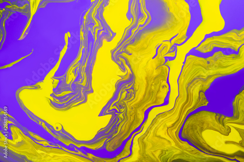 Acrylic Fluid Art. Glowing yellow waves on purple background. Abstract marble background or texture