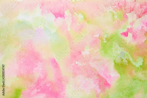 Abstract pink-green watercolor background, bright, contrast splashes, drops, smudges. Artistic background with paper texture. © taisiyakozorez