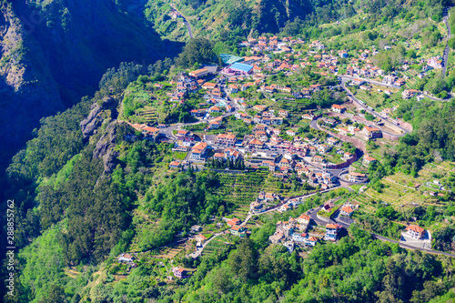 View from Eira do Serrado to Curral das Freiras village in the Nuns Valley in beautiful mountain scenery, municipality of Câmara de Lobos, Madeira island, Portugal. photo