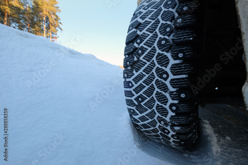 Winter tire with spikes in snow