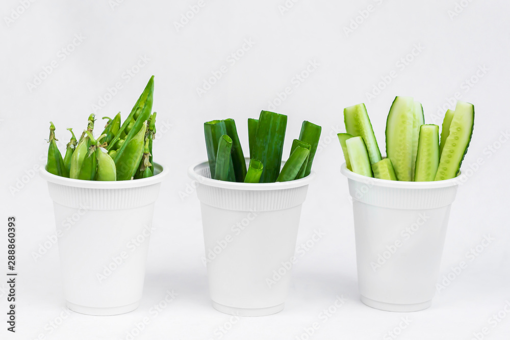 Natural, plastic free biodegradable dishware with green vegatables. Concept of eco and green lifestyle. Organic foods and fresh vegetable Natural, plastic free biodegradable dishware with green vegatables. Concept of eco and green lifestyle. Organic foods and fresh vegetable