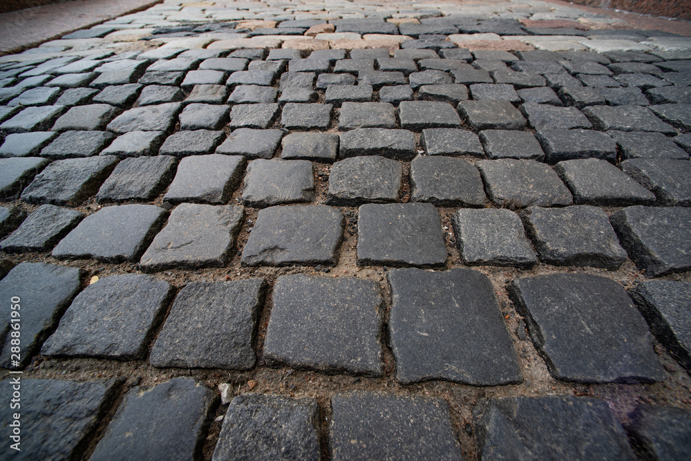 Fototapeta premium Texture of square paving stones in perspective