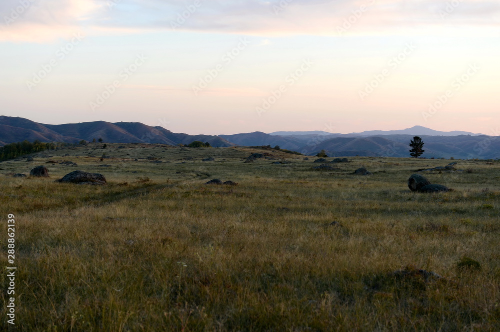 An evening in the Altai mountains near the Charysh River. Western Siberia