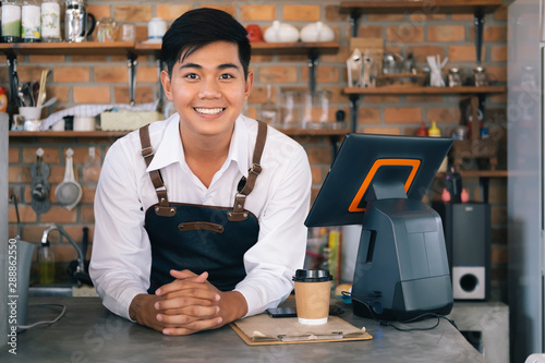 Photos Small business happy owner of a coffee cafe.