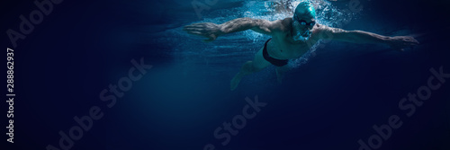 Fit swimmer training by himself © vectorfusionart