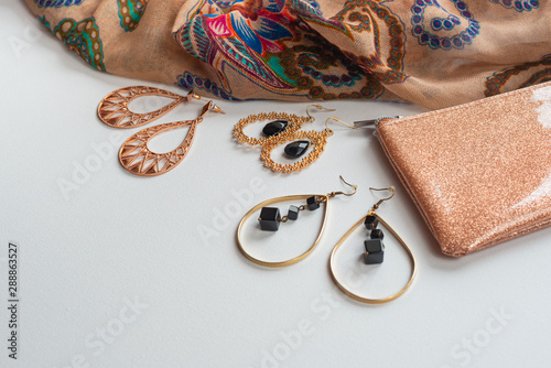 Women's fashion accessories in Oriental style on a white background Blue scarf jewelry handbag earrings