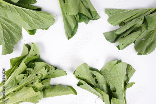 fresh spinach leaves on wooden background