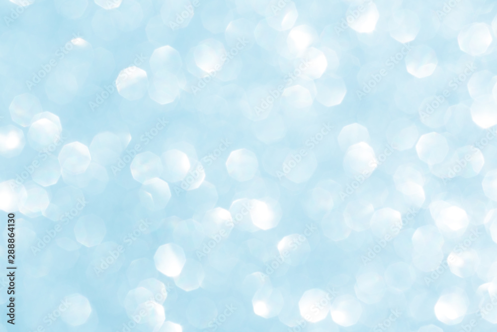 Abstract blue glitter background. Sparkle blue bokeh christmas or winter background.