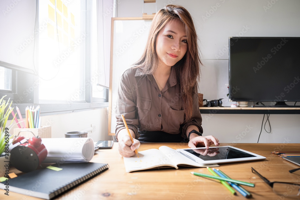 Architect woman sketching on notebook at design Studio. Creativity Ideas concept Architect woman sketching on notebook at design Studio. Creativity Ideas concept