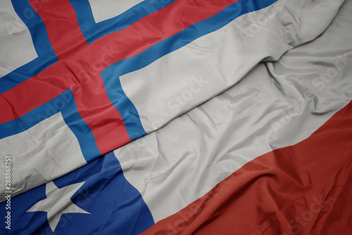 waving colorful flag of chile and national flag of faroe islands.