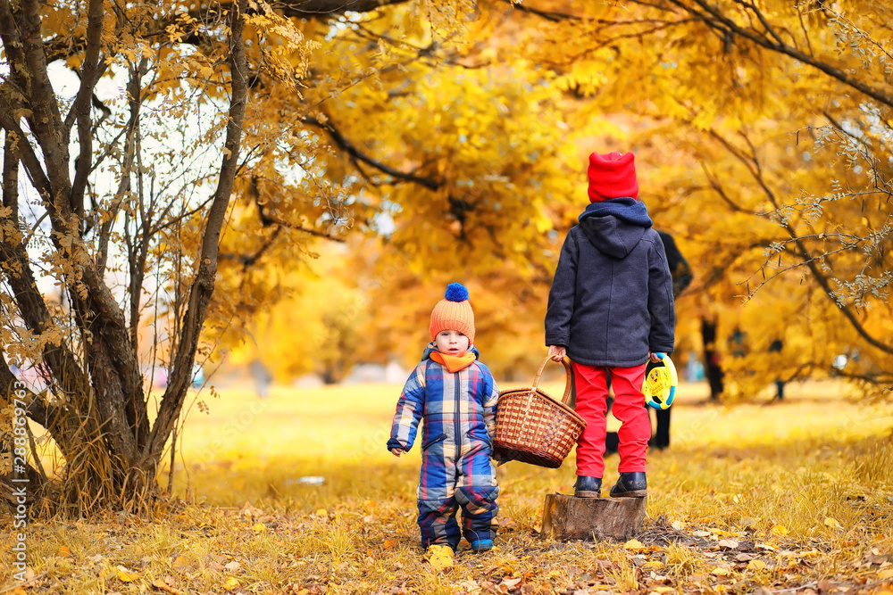 Family in autumn park in the afternoon