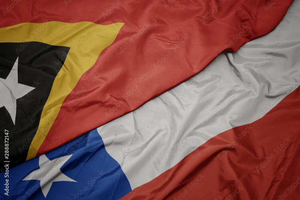 waving colorful flag of chile and national flag of east timor.