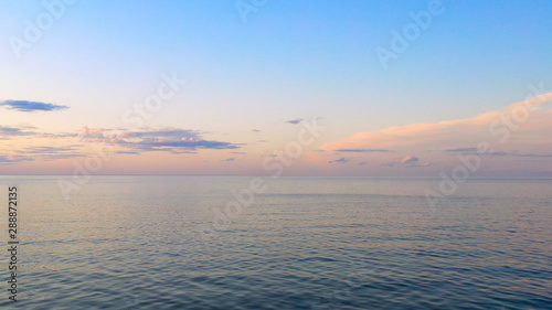 Aerial view wonderful dark silver sea with sunset twilight sky in the evening time. Scenery moment. spirit of serene and zen. image for background, wallpaper, interior