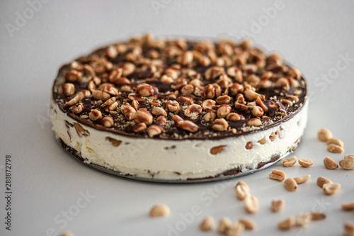 Tasty cheesecake with chocolate and nuts