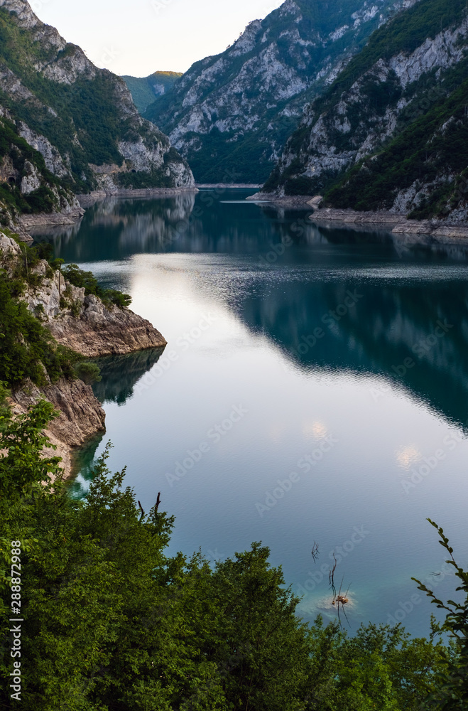 Piva Lake (Pivsko Jezero) evening view in Montenegro. Piva Lake (Pivsko Jezero) evening view in Montenegro.