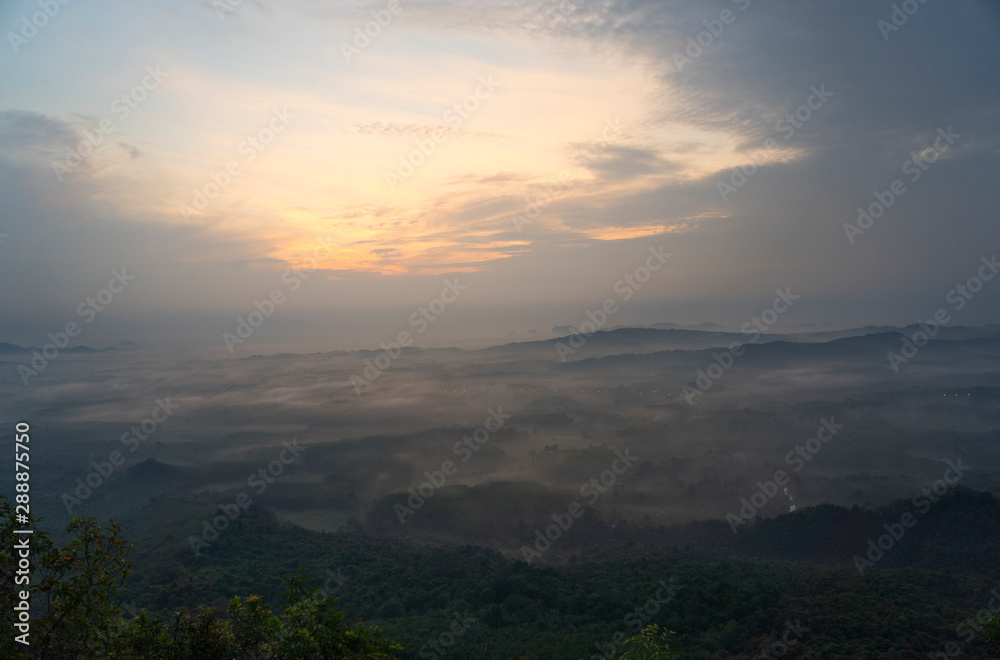 Magical sunet with sea of clouds. Landscape photo was taken from Wang Pha Mek, highlands of Trang, Thailand.