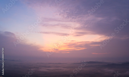 Magical sunet with sea of clouds. Landscape photo was taken from Wang Pha Mek, highlands of Trang, Thailand. © sorawat