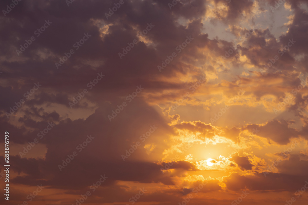 Beautiful sky, dawn, the rays of the sun break through the clouds. Natural background.